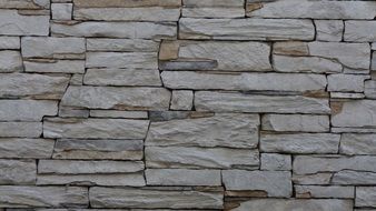 gray stone wall with cracks