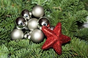 red Christmas star and silver baubles