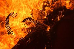 background with metal construction in fire