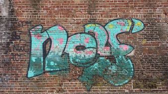 graffiti on a brick wall