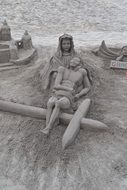 black and white picture of sand statue