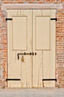 old wooden door of a brick house