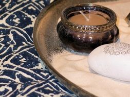 oriental candle and meditation stone