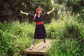 woman posing by the river