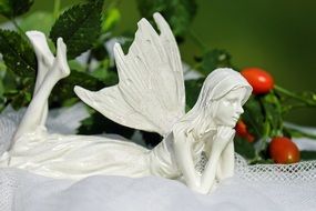 white figurine of a fantasy woman