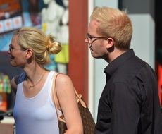 caucasian Woman and Man looking with Interest at shop window