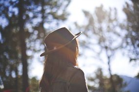 back view of Female Person in vintage hat outdoor