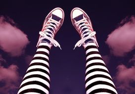 legs with sneakers and striped socks