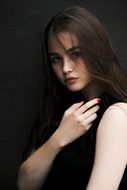 portrait of a beautiful girl in a black dress