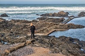 lonely traveler on a rocky beach