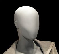 Female Mannequin head at black background