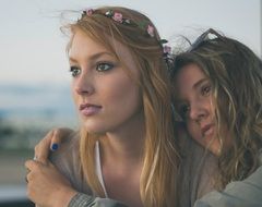 portrait of two sisters in the street