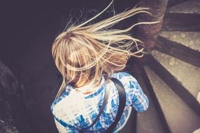 girl with white hair on the stairs