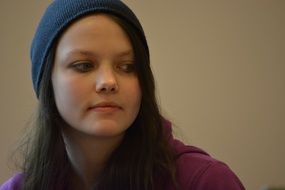 girl in a blue knitted hat