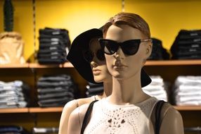 two mannequins in sunglasses