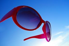 sunglasses against blue sky