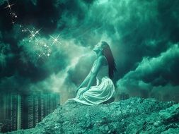 girl in prayer in a mystical landscape
