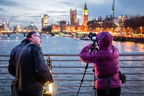 photographers on the bridge of night london