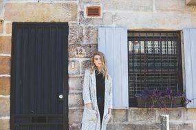 young woman near the house