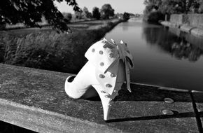 black and white photo of a woman's shoe