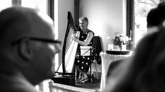 old lady playing Harp, Black And White