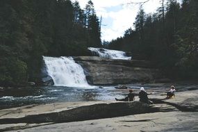 People by the Waterfall