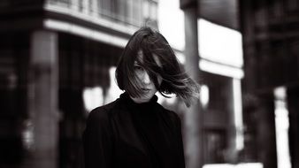 Fashionable girl in the wind
