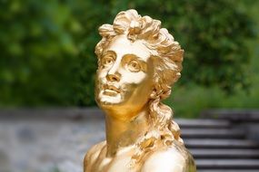 Gold sculpture of woman