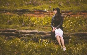 Girl in autumnal grassland