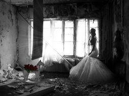 girl in a wedding dress in a ruined house