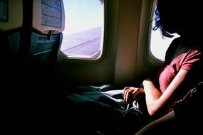 girl on the plane at the window