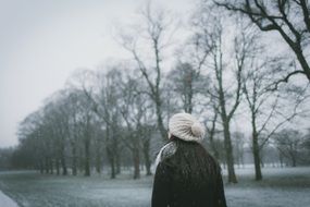 girl in a cute hat on a snowy day