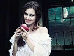 woman with apple under the moonlight