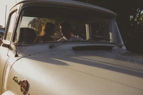 couple in love in a retro car Ford