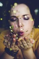 Woman Blowing Stars