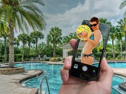 Girl in bikini in the phone