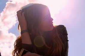 silhouette of a young woman in bright sunshine