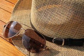 sunglasses and straw hat