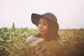 Pretty girl with brown hat on her head