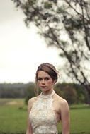 bride in a wedding dress on a background of nature