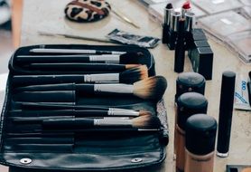 brushes and makeup products on the table
