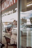 woman outside the window in the laundry
