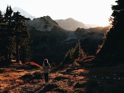 woman outdoors near a mountain