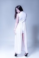 brunette in a long white dress