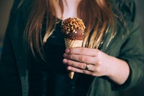 Sweet ice cream in a woman's hand