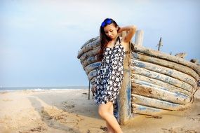 girl on the background of a wooden boat on the beach in Sydney