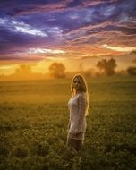 Young model under the sunset in summer