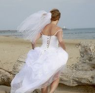 bride in white dress on the beach