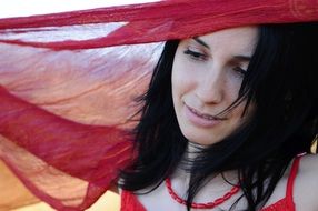 Woman with red scarf