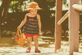 little girl walking outside